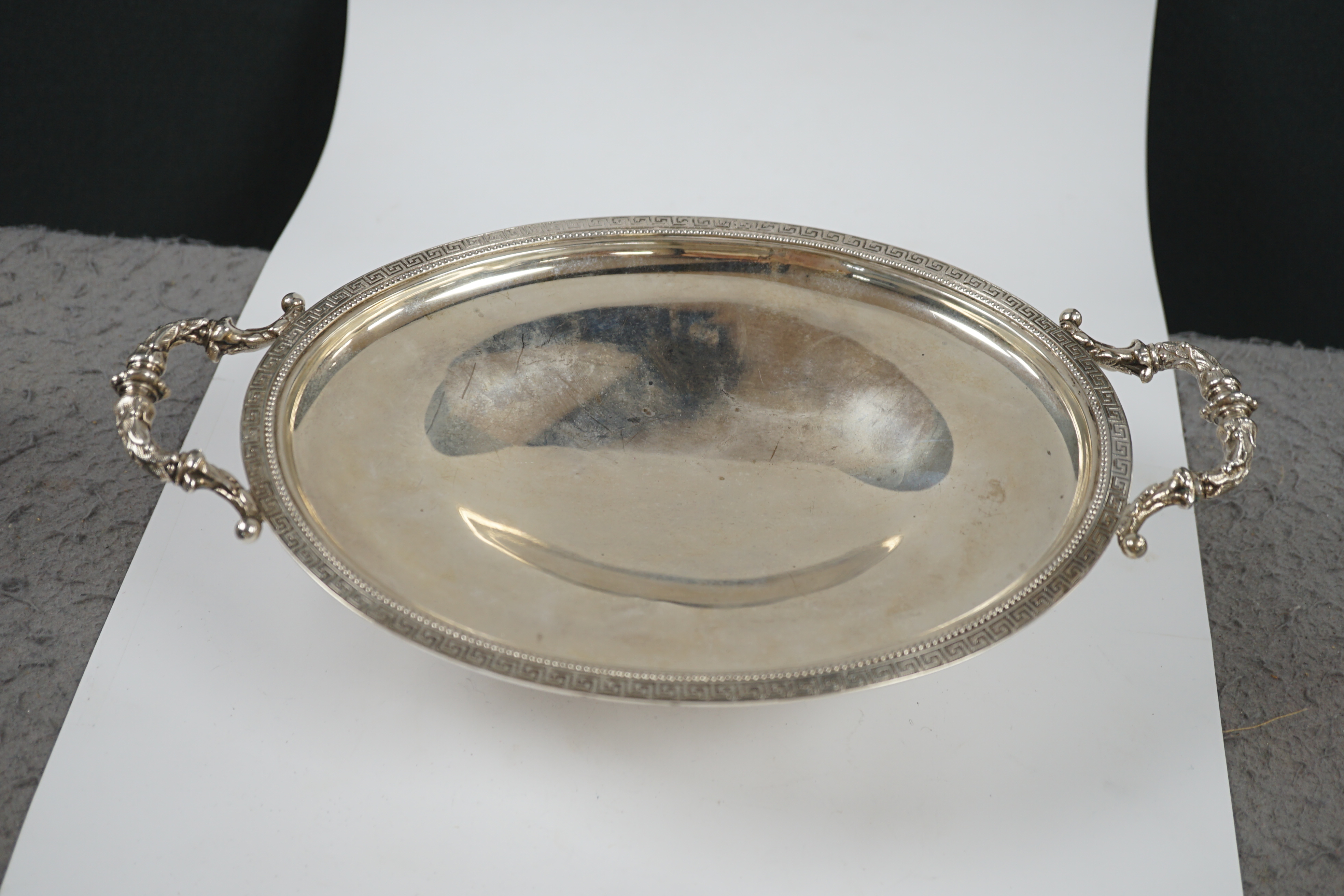 An American sterling two handled oval pedestal dish, 31.1cm over handles, 14.5oz. Condition - fair to good
